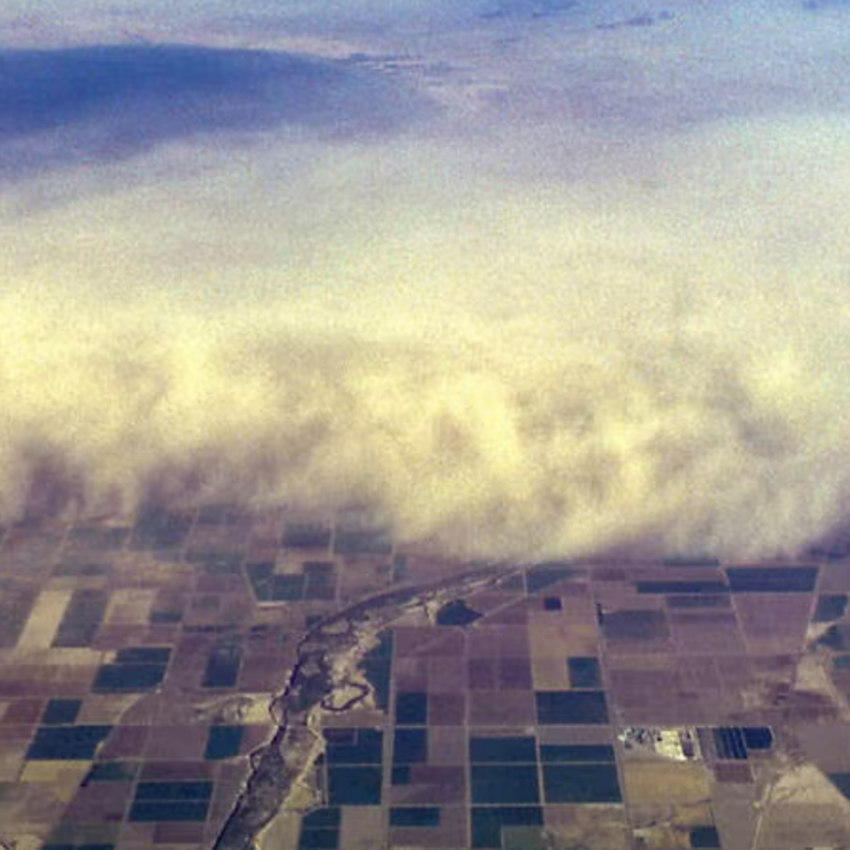 An aerial view of a dust storm overrunning the Imperial Valley, California. The Salton Sea can be seen upper left.