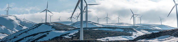 wind turbines on snow covered hills (c) Jason Blackeye unsplash